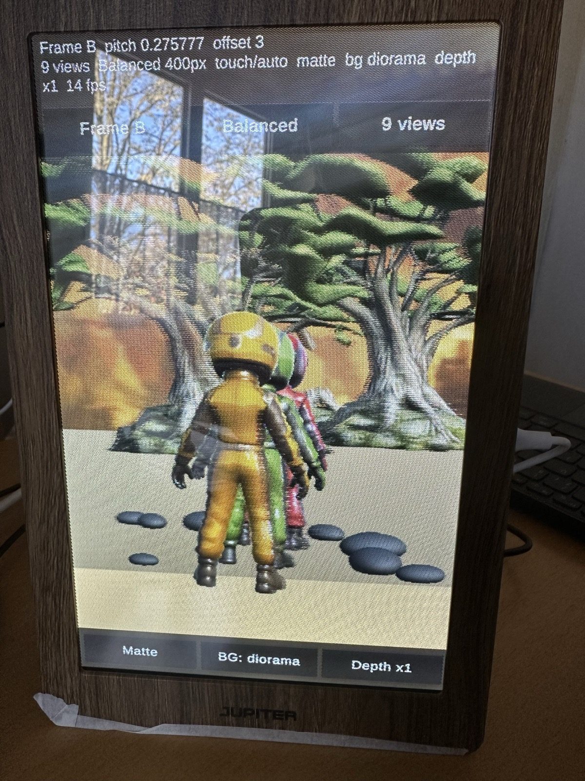 The frame showing three kids walking toward a big tree.
